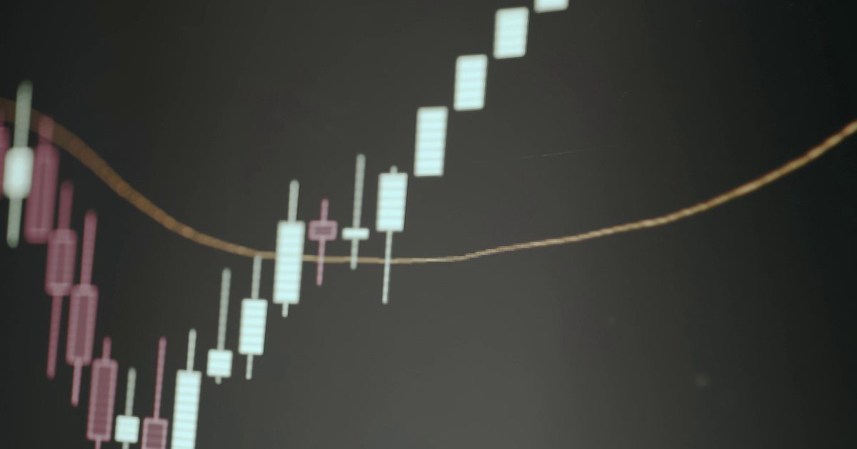 Candlestick price chart with a moving-average line on a trading screen